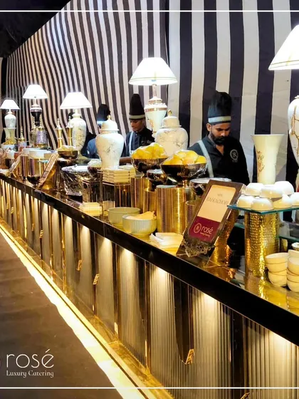 A long shot of our Pan-Asian station against a striking black and white striped wall. This demonstrates our ability to create visually impactful setups that match your event's theme.
