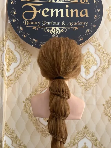 A clear view of a bubble braid, also known as a parachute braid. This is a trendy and fun hairstyle that is easy to create once you learn the technique.