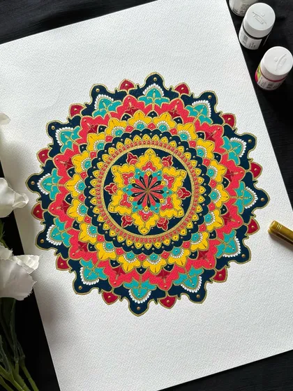 The beauty of ornate mandalas lies in their rich colors and bold patterns. This piece, painted with acrylics, shows how we can combine traditional motifs with a vibrant palette to create something truly stunning.