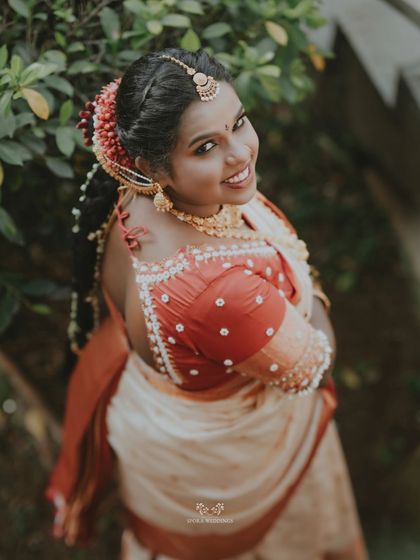 A beautiful portrait of the bride looking over her shoulder with a radiant smile.
