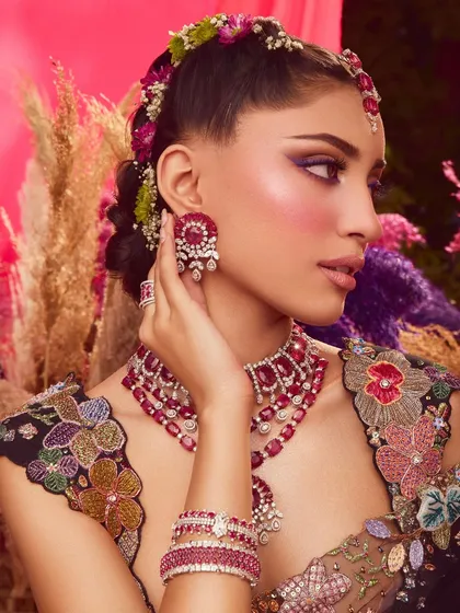 From another angle, you can see how the colorful makeup, hair, and styling all come together to create a cohesive and stunning visual story.