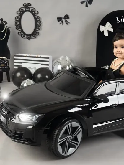 For this little girl's first birthday, we went for a chic and stylish theme. Seeing her behind the wheel of this mini Audi, looking like a little star, was just the cutest thing.
