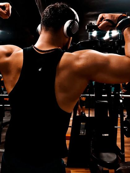Tracking back day progress is crucial. Posing allows us to see how the muscles are developing and where we need to focus our efforts for better symmetry and size.