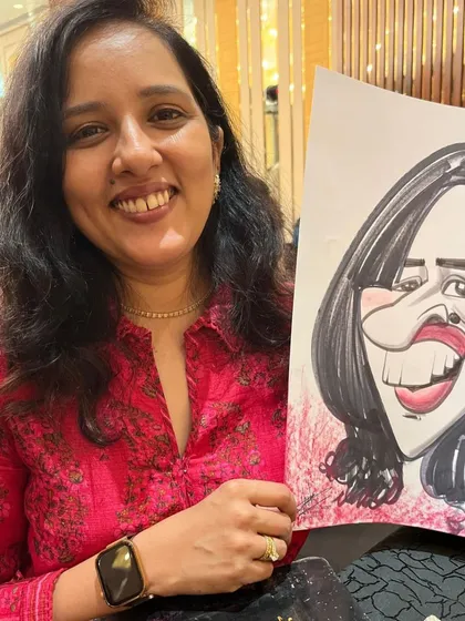 A guest from the Sheraton event, delighted with her caricature.