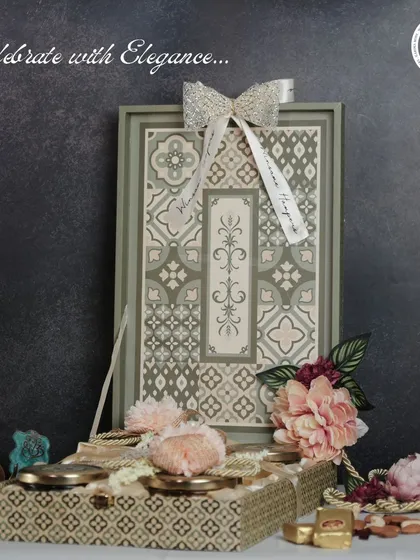 Celebrate with elegance using this sophisticated gift set. It features a beautifully patterned tray and a matching box filled with gourmet sweets and nuts, perfect for a refined Diwali present.