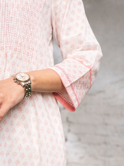 Another look at the sleeve details of our Suhani Appliqué edit. The careful tucks and contrast trims are not loud, but they bring the whole design together with a sense of quiet confidence.