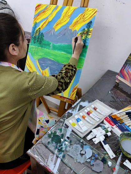 Follow a student's progress on a vibrant landscape painting, showing the development from a simple sketch to a fully colored and detailed scene.