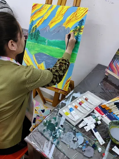 Follow a student's progress on a vibrant landscape painting, showing the development from a simple sketch to a fully colored and detailed scene.