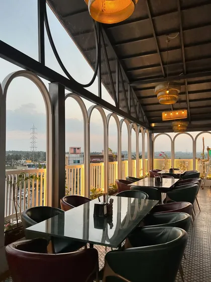 The view from the dining area at The Soda Factory in Mandya. The plants along the periphery don't obstruct the view but frame it, adding to the experience of being in a relaxed, green space.