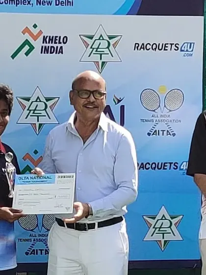 A player receiving her award certificate at the DLTA Nationals.