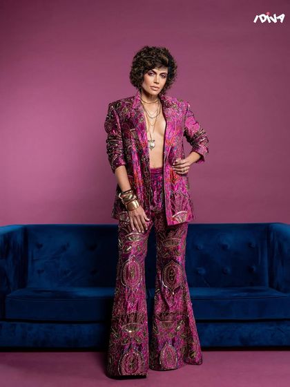 Another full-length view from the iDiva feature, this time with a slightly different pose to convey a relaxed yet commanding presence.