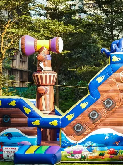 Ahoy, matey! Our pirate ship inflatable is more than just a bouncy castle, it's an adventure zone with slides and climbing areas, perfectly themed for an aquatic or pirate adventure party.