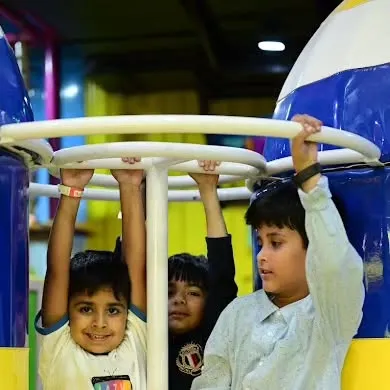 Friends working together to spin on one of our playground structures. It's all about interactive, social play.