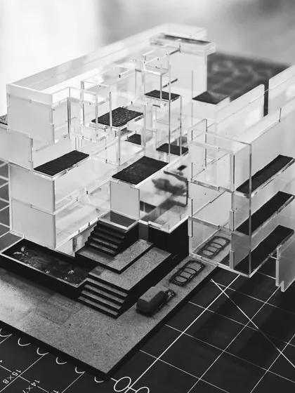 The completed acrylic model for a New Delhi residence, showing the intricate arrangement of floors, balconies, and open spaces. This level of detail helps us visualize the human experience within the building.