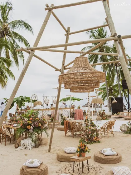 Showcasing our destination event capabilities, this 'Rustic Tropics' beach setup in Mauritius uses natural wood, cane, and exotic florals for an effortlessly chic celebration.