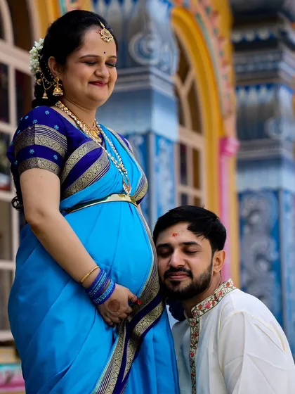 A tender moment between the couple, with the father-to-be listening to the baby bump. This is a classic pose that beautifully captures the anticipation of parenthood.