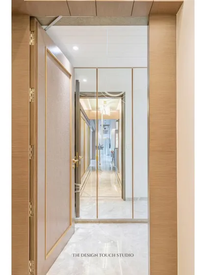 A view from the doorway, showing how mirrored wardrobes can transform a passageway, making it feel brighter and more open.