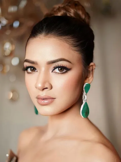 A close-up of our signature glam. The sharp, winged eyeliner is the star of the show, creating a look that is both bold and sophisticated.