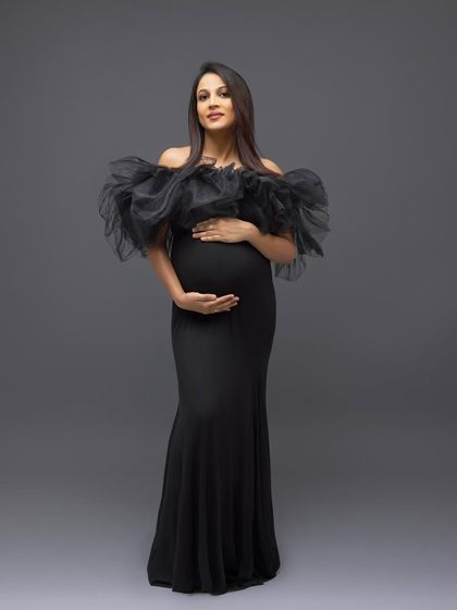 A colored version of the classic full-length portrait, showing the dramatic silhouette of the black gown.