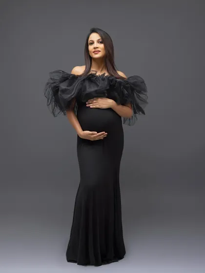 A colored version of the classic full-length portrait, showing the dramatic silhouette of the black gown.