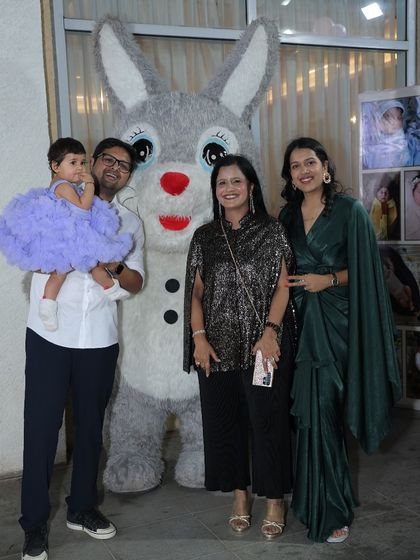 The happy family with the birthday girl and our bunny mascot. It's all about creating joyful memories for everyone.