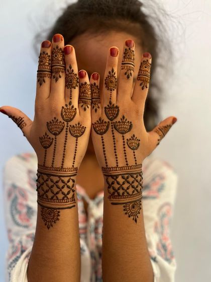 A lovely Eid design for a child, with hanging flower motifs and a geometric wristband.