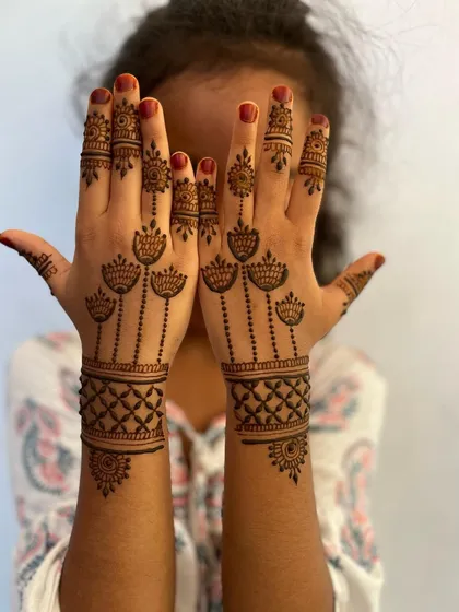A lovely Eid design for a child, with hanging flower motifs and a geometric wristband.