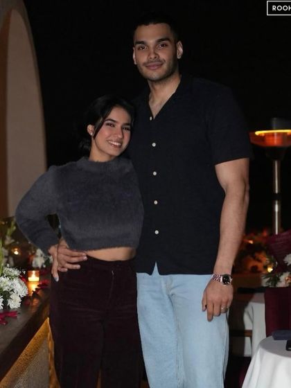 A candid moment of connection during a romantic dinner. My goal is to provide a comfortable and beautiful setting where couples can simply enjoy being together.