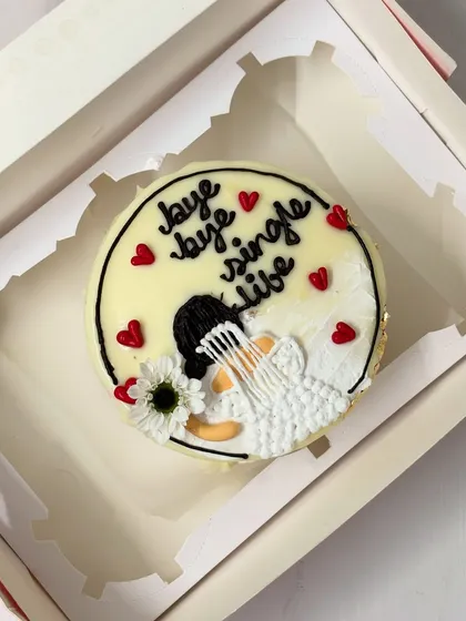 A cute bento cake for a bride-to-be, saying "bye bye single life". The hand-piped bride illustration makes it extra special.