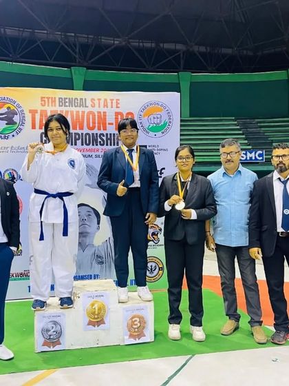 Athletes on the podium at the Bengal State Championship, representing different belt levels and age groups.