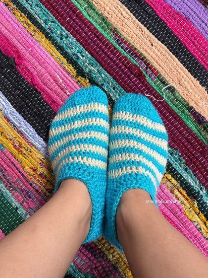 Our cozy striped crochet socks, perfect for lounging at home during the winter months.