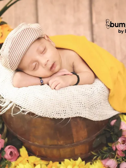 A close-up of the newborn in the sunflower bucket, wearing an adorable newsboy cap. I focus on different angles to give you a variety of beautiful shots.
