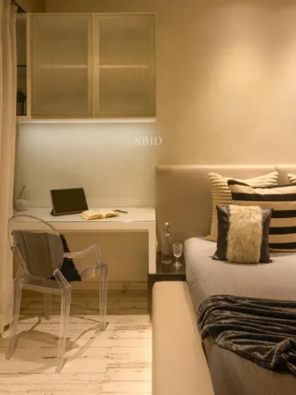 The client brief was "I want a black room," a common request from teenagers. My solution was to use black smartly, pairing a large platform bed and a grey stucco curved wall for his TV and Playstation with a bright study area near the window.