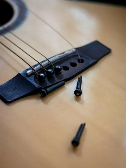 The process of removing the old strings. It's a necessary ritual for any guitarist.