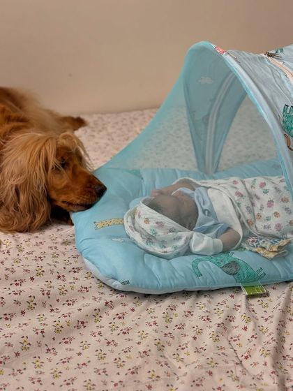 A quiet moment of guardianship. Posto watching over his baby brother sleeping safely in his mosquito net bed.