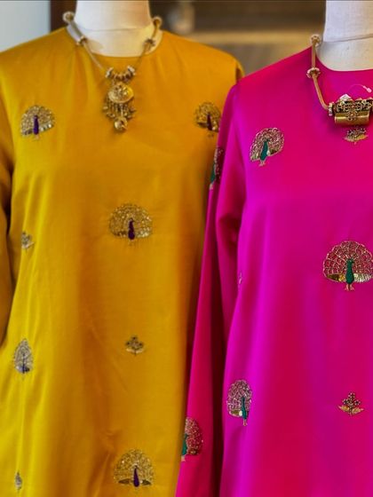 A detailed shot of the exquisite peacock embroidery, a signature of Raw Mango's timeless designs.