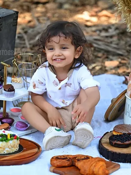 A sweet, smiling portrait from the themed picnic session.