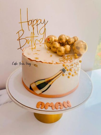 Popping bottles and celebrating in style with this champagne-themed cake.