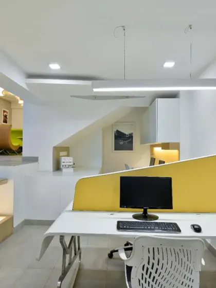 The lower level of my studio, designed with a smart, space-saving layout for our interns and junior architects. A clean white interior and effective task lighting create a bright and productive workspace.