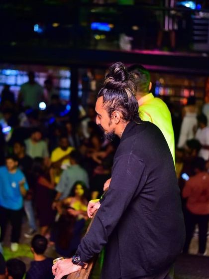 Looking out over the dance floor from my elevated DJ booth. This is my vantage point for reading the crowd and guiding the night's energy.