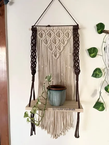 I love making pieces that are beautiful and useful! This macrame floating shelf is perfect for holding a small plant, some books, or your favorite little treasures. The dark brown and natural off-white cotton gives it a lovely contrast.