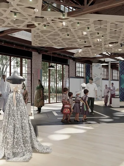 An interior view of the repurposed Solina Silk Factory, envisioned as an exhibition hall for local Kashmiri artisans. The design respects the building's original volume and light, using modern geometric ceiling panels to define the space without compromising its industrial soul.