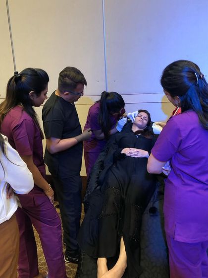 A photo from a previous Aestheticon event, showing a hands-on training session in progress. Join us for an amazing day of real experience.
