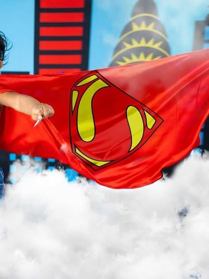 It's a bird, it's a plane, it's Super-Baby! This dynamic shot shows our little hero flying through the clouds above a cityscape, a fun and empowering theme for any toddler.