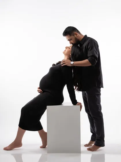 A wider angle of the same pose, showing the full silhouette and the simple, modern aesthetic of the shot.