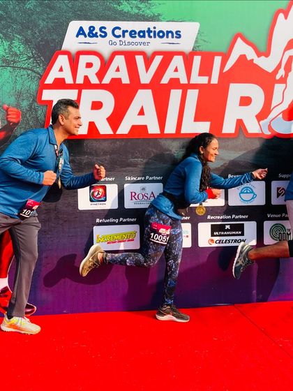 Having some fun at the finish line backdrop of the Aravali Trail Run.