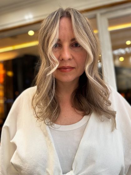 A full view of the pearl blond transformation, showcasing the beautiful color and flattering style.