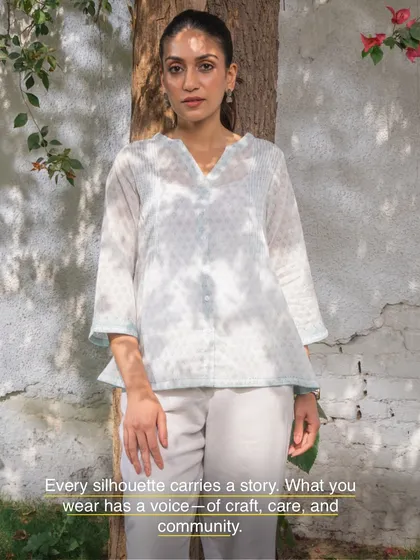 Every silhouette carries a story. This Suhani flared top, with its tie-dye effect and delicate appliqué, has a voice of craft, care, and community, made to be worn and loved for years.