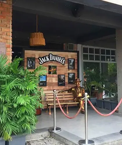 The entrance to the Pub Factory in Gurgaon, where I used large potted areca palms to create a lush, welcoming entryway that complements the venue's rustic theme.