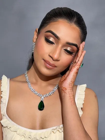 Eyes closed, this shot highlights the beautiful gold shimmer and the precise winged liner taught in my advanced course.